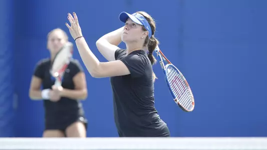 Capra Advances in Singles, But Doubles Teams Falter