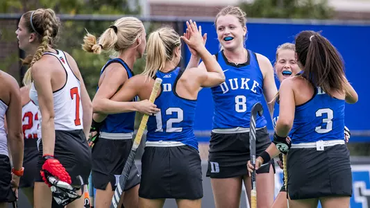 Noor van de Laar high-fiving Margaux Paolino against Princeton