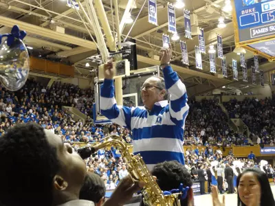 man conducting band in Cameron Indoor Stadium