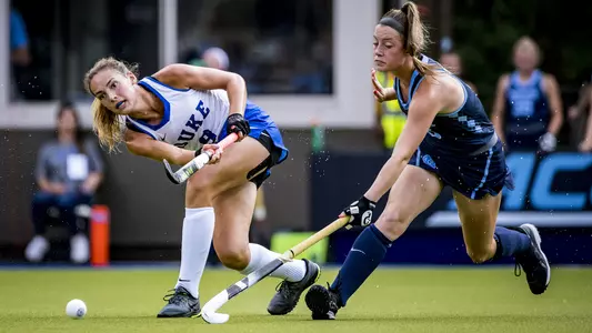 Lily Posternak dribbles the ball away from a UNC player