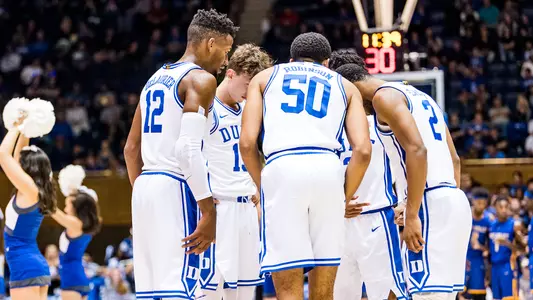 Javin DeLaurier, Alex O'Connell, Justin Robinson, Cassius Stanley and Tre Jones huddle up during the Fort Valley State game.