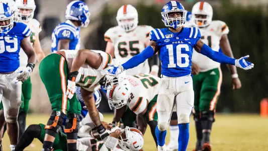 Dylan Singleton celebrates after taking down the Miami quarterback