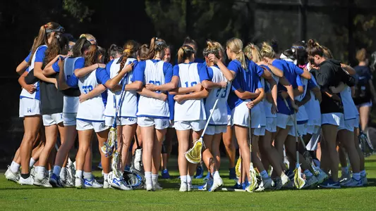 Women's lacrosse huddle during fall play
