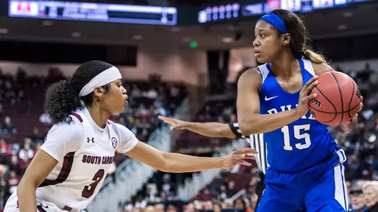 Kyra Lambert guarded by a South Carolina defender