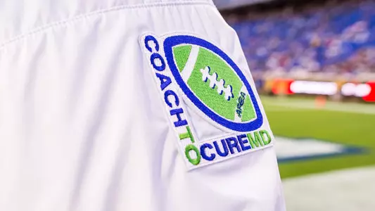 One of the Duke coaches represents the CoachToCure MD initiative during their game with Virginia Tech.