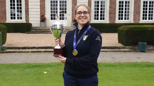 Virginia Elena Carta holds trophy