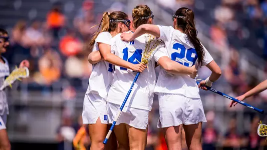 women's lacrosse celebrates a goal