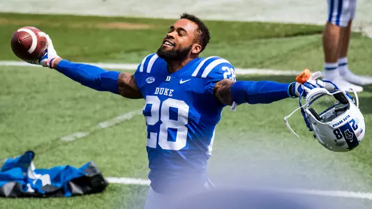 Mark Gilbert celebrates after making an interception against Boston College