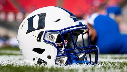 A Duke football helmet sits on the sideline during pregame of Duke's contest with North Carolina State