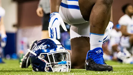 A Duke football helmet sits next to a player prior to 2019 spring practice