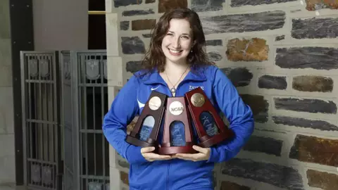 Duke fencer Becca Ward poses with her NCAA trophies.Jon Gardiner/Duke Photography
