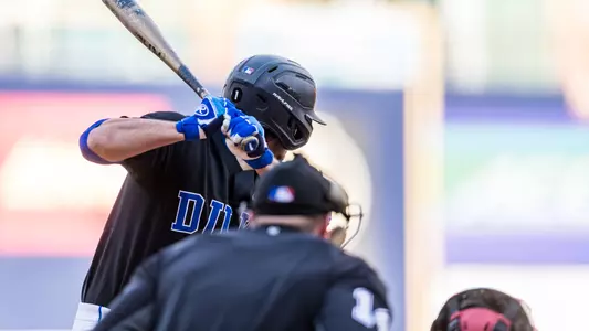 A Duke baseball player gets ready for his at bat