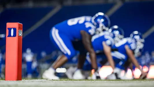 Members of the Duke football team warm up prior to the Blue Devils contest against Miami