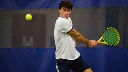 Garrett Johns eyes up the ball during Duke's match with Elon