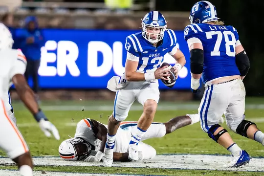 Quarterback Riley Leonard looks downfield during Duke's home game against Virginia