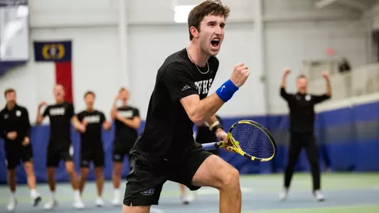 Sean Sculley celebrates after a key point was earned during doubles play