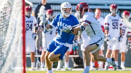 Garrett Leadmon dodges against a Penn defenseman