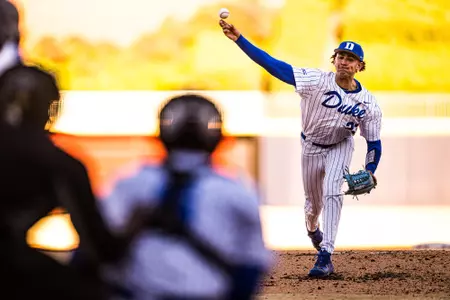 Marcus Johnson throws a pitch during a Duke baseball game.