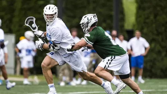 Garrett Leadmon tries to beat a Loyola defenseman down the field