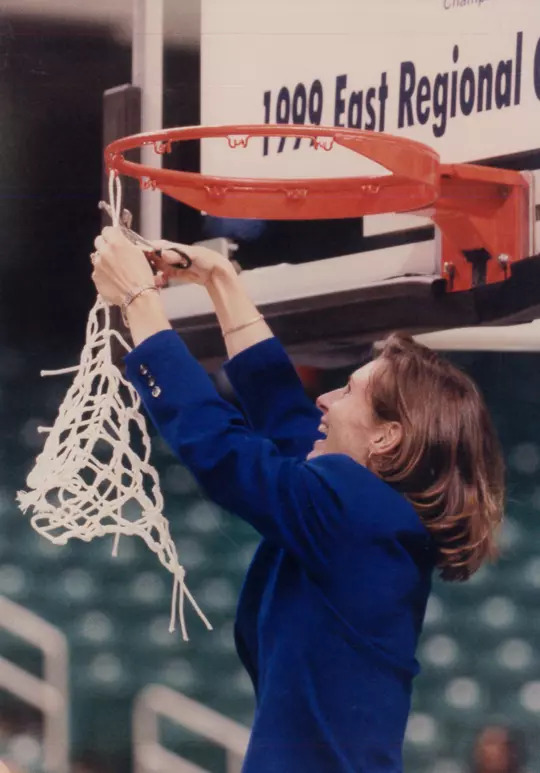Basketball coach Gail Goestenkors cuts down the nets