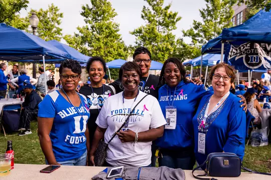 Six family members of Duke football players enjoy a pregame tailgate