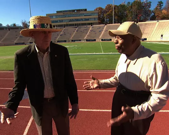 Al Buehler visits with his longtime friend and colleague Leroy Walker at Wallace Wade Stadium.