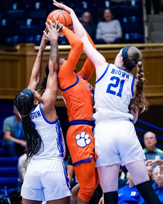 Elizabeth Balogun and Kennedy Brown block a Clemson player's shot