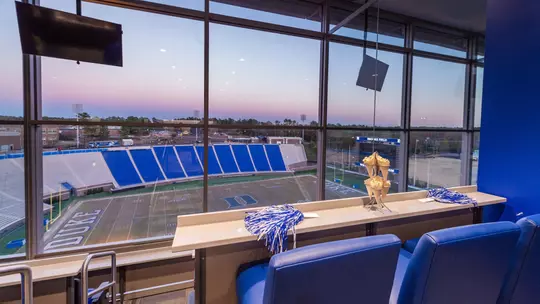 A sunset view from a Blue Devil Tower suite overlooking Brooks Field at Wallace Wade Stadium