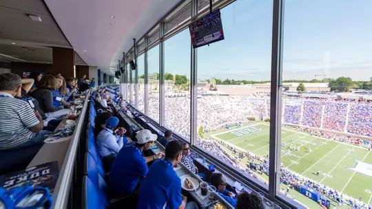 Duke football fans enjoy a game from the DeJoy Family Club