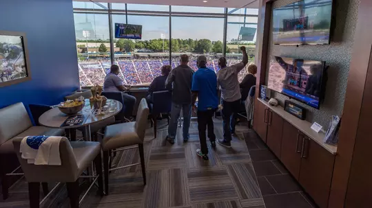 Duke fans cheer from a Blue Devil Tower suite