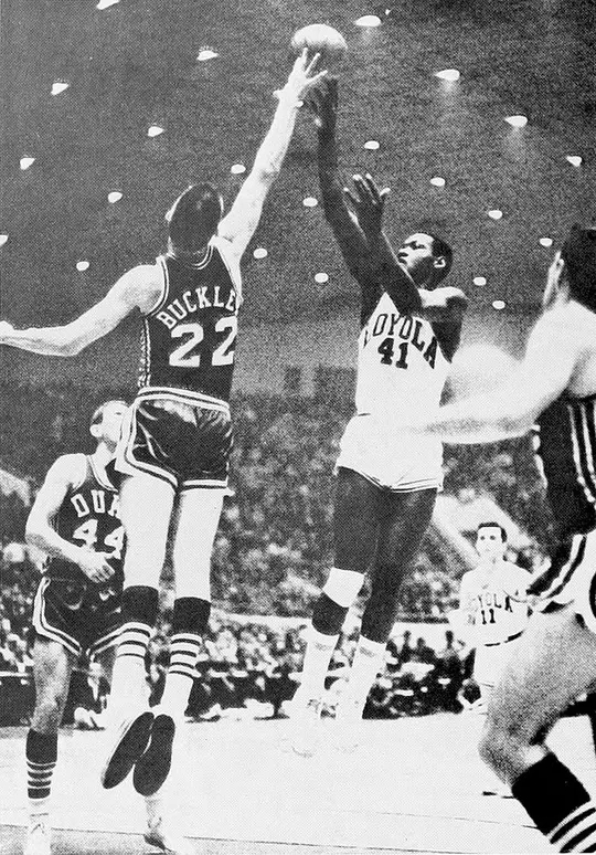 Duke center Jay Buckley blocks Les Hunter of Loyola during the NCAA national semifinal.