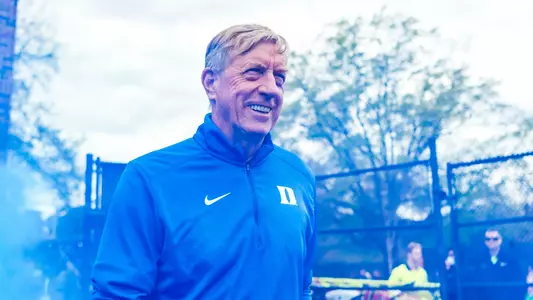 John Danowski walks onto the field