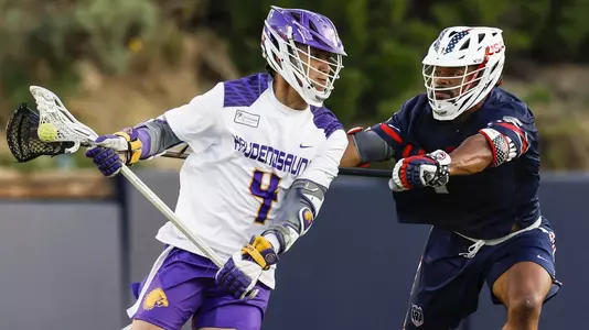 JT Giles-Harris plays defense against Lyle Thompson at World Lacrosse Championships