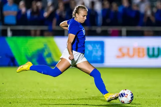 Duke's Emily Duerr kicks the ball during a Duke women's soccer game against UNC