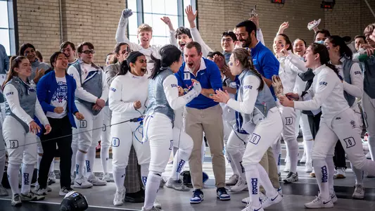 Duke fencing celebrates a win at the Philadelphia Invitational