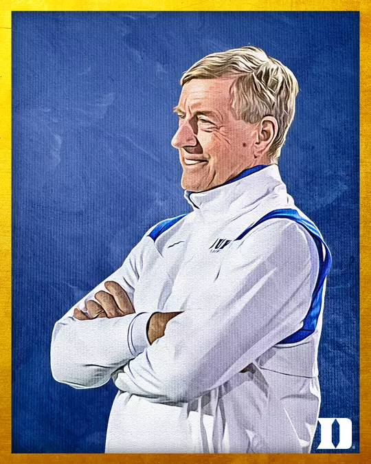 Hall of Fame portrait of John Danowski, a Duke lacrosse coach, shown smiling with arms crossed. He is wearing a white jacket with blue accents. The image has a blue textured background with a yellow border, and a Duke 'D' logo in the lower right corner.