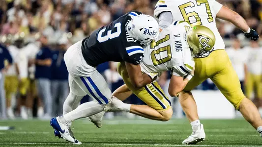 Alex Howard makes a tackle on Georgia Tech quarterback Haynes King.