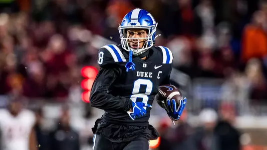 Jordan Moore runs after a catch against Virginia Tech on Senior Night.