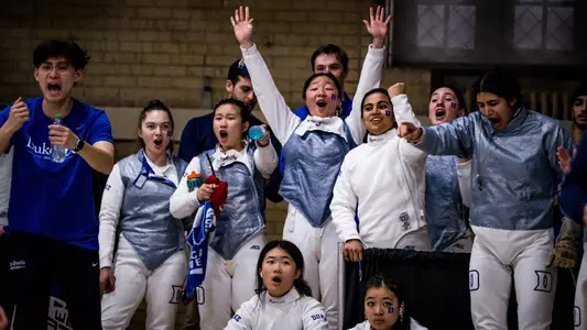 Duke women's fencing celebrates in Card Gym