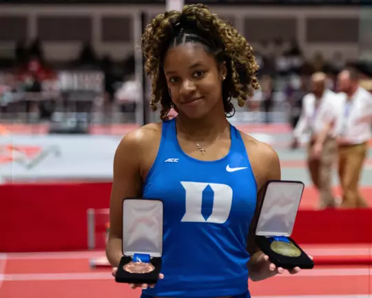 Brianna Smith poses with her medals from the ACC Indoor Track & Field Championships.