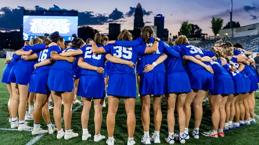Duke women's lacrosse huddles at the acc championship
