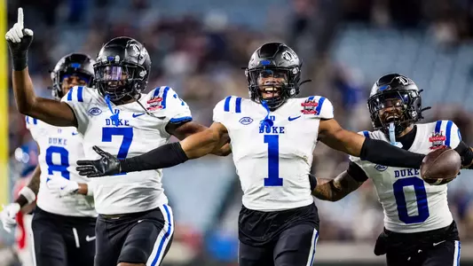 Terry Moore, Vincent Anthony Jr. and Chandler Rivers celebrate a Moore interception versus Ole Miss in the Gator Bowl.