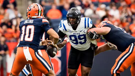 Duke defensive tackle and captain Aaron Hall rushes the quarterback during the Blue Devils' 38-3 victory at Syracuse on September 27, 2025.