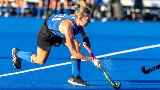 Paige Bitting makes a pass on the blue turf at University of Virginia
