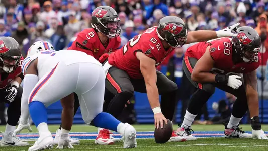 Former Duke offensive lineman points and gets ready for a snap with the NFL's Tampa Bay Buccaneers against the Buffalo Bills.