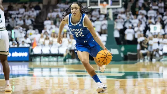 Taina Mair of Duke women's basketball drives to the basket with her left hand