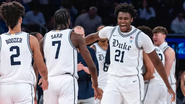 Patrick Ngongba celebrates with Duke Men's Basketball teammates during 2025 Champions Classic at Madison Square Garden versus Kansas