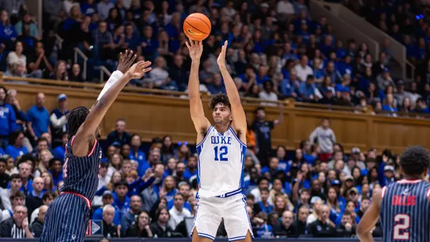 Cameron Boozer shoots a three-pointer against Howard