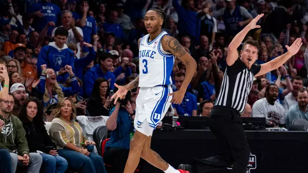 Isaiah Evans celebrates a made three-pointer against Texas