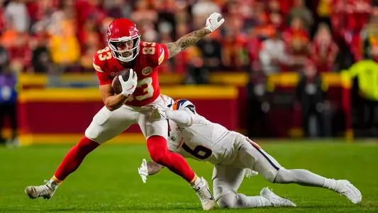 Former Duke tight end Noah Gray, wearing a red helmet, red jersey and white pants, makes a catch for the Kansas City Chiefs against the Denver Broncos on Christmas night in 2025.